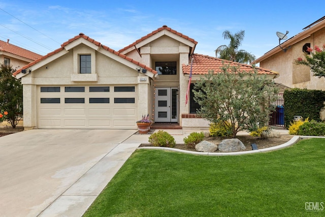 8220 Birmingham St, Bakersfield, CA 93311 - view of front facade with driveway, a tile roof, an attached garage, and a front yard