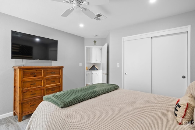8220 Birmingham St, Bakersfield, CA 93311 - bedroom featuring a closet, light wood-style floors, ceiling fan, and baseboards
