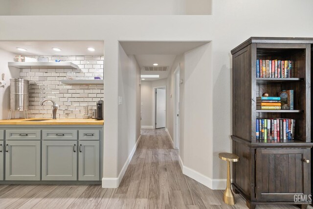 8220 Birmingham St, Bakersfield, CA 93311 - corridor with light wood-type flooring, baseboards, and recessed lighting