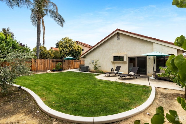8220 Birmingham St, Bakersfield, CA 93311 - rear view of house featuring stucco siding, a patio, and central AC