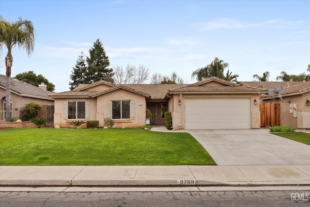 single story home featuring a garage and a front lawn