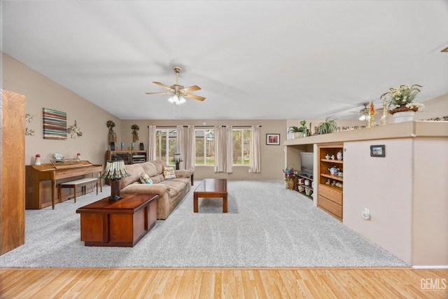 living room featuring ceiling fan and wood-type flooring