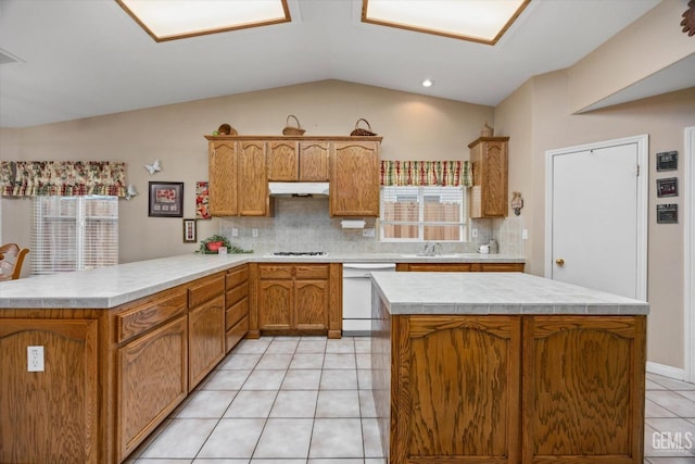 kitchen featuring light tile patterned floors, white appliances, backsplash, vaulted ceiling, and kitchen peninsula