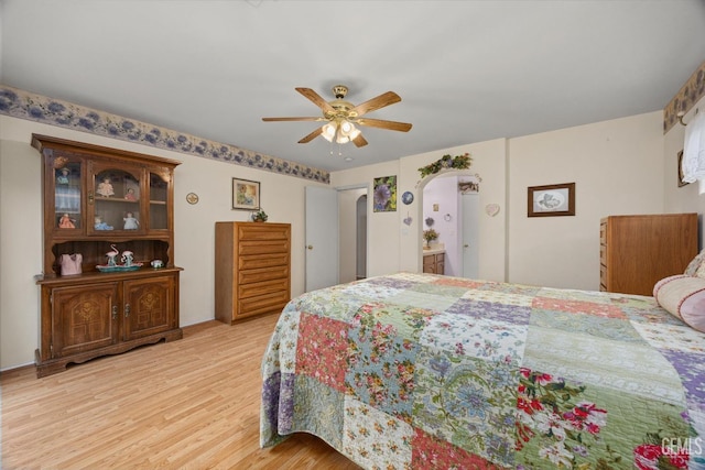 bedroom with light hardwood / wood-style flooring and ceiling fan