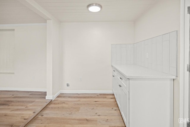 interior details featuring beamed ceiling and wood-type flooring