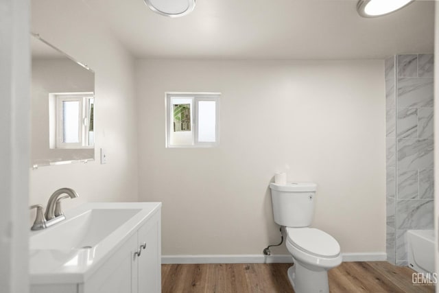 full bathroom with vanity, shower / bathtub combination, toilet, and wood-type flooring