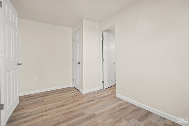 spare room featuring light hardwood / wood-style flooring