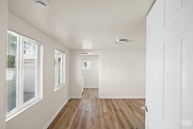 unfurnished room featuring light wood-type flooring