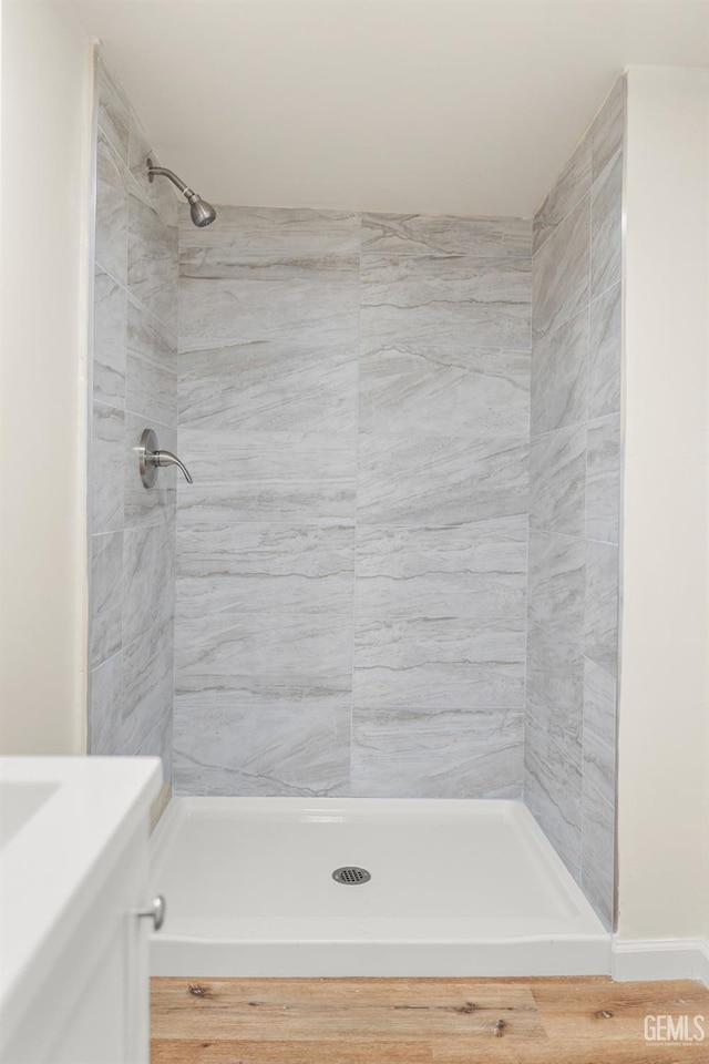 bathroom with a tile shower