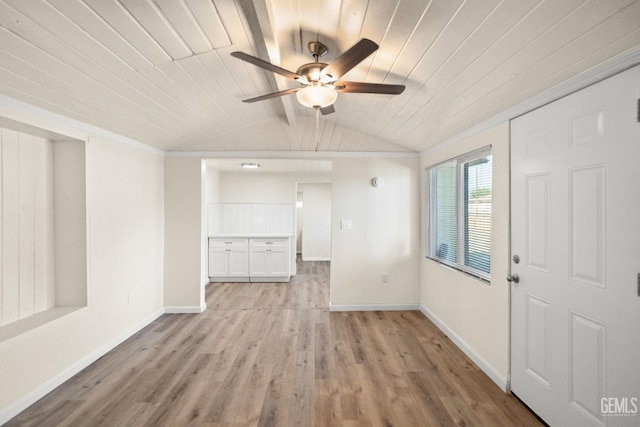 spare room with ornamental molding, wood ceiling, ceiling fan, light hardwood / wood-style flooring, and lofted ceiling