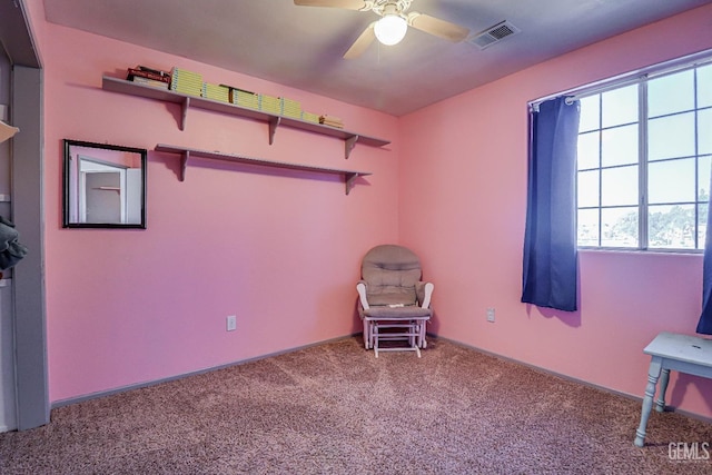 interior space with ceiling fan and carpet floors