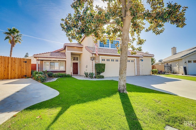 view of front of property featuring a garage and a front lawn