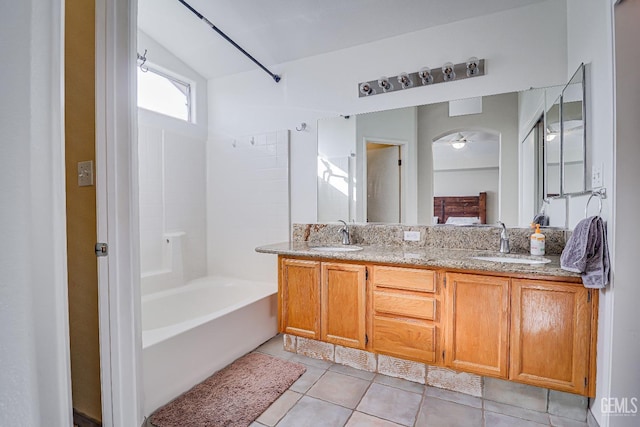 bathroom featuring ceiling fan, tile patterned flooring, vanity, and bathtub / shower combination