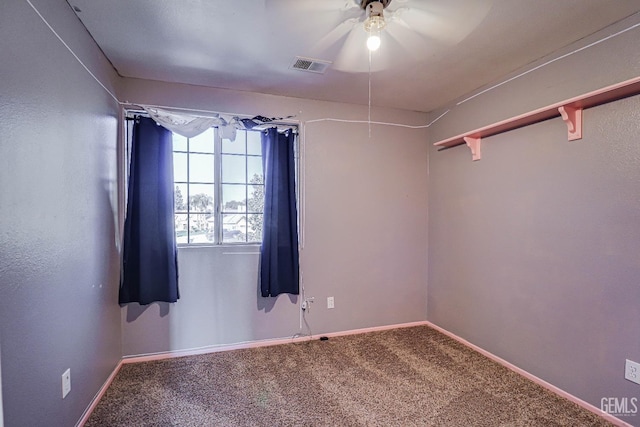 unfurnished room with carpet and ceiling fan