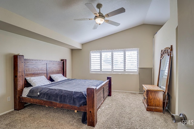 bedroom with carpet floors, vaulted ceiling, and ceiling fan