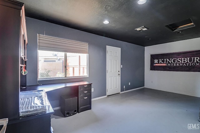 office featuring concrete flooring and a textured ceiling