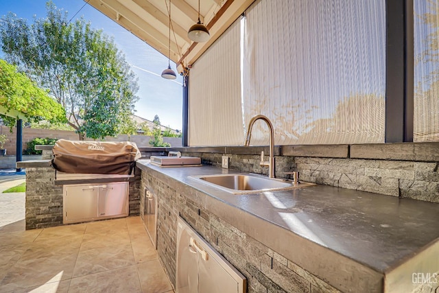 view of patio with sink and an outdoor kitchen