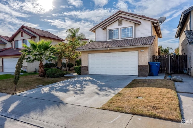 front facade featuring a front lawn and a garage