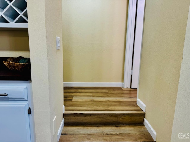 4208 Tierra Verde St Unit 2, Bakersfield, CA 93301 - staircase featuring baseboards and wood finished floors