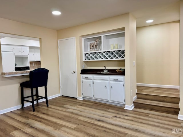4208 Tierra Verde St Unit 2, Bakersfield, CA 93301 - indoor wet bar with light wood finished floors, recessed lighting, paneled refrigerator, and tasteful backsplash