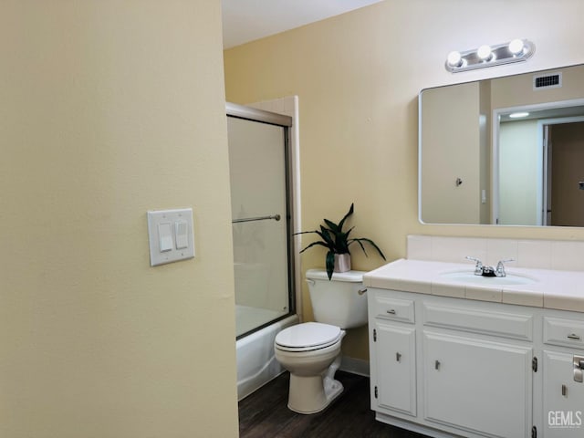4208 Tierra Verde St Unit 2, Bakersfield, CA 93301 - bathroom featuring vanity, wood finished floors, and enclosed tub / shower combo