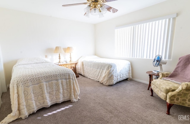 bedroom featuring ceiling fan and carpet floors