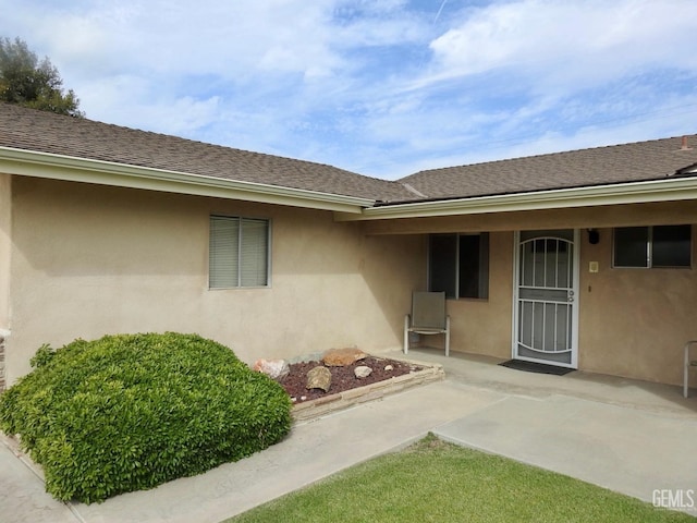 doorway to property featuring a patio