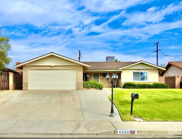 single story home featuring a front yard and a garage