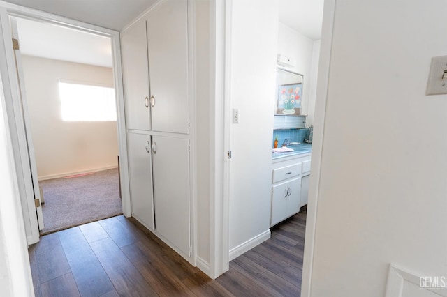 hallway with dark wood-type flooring