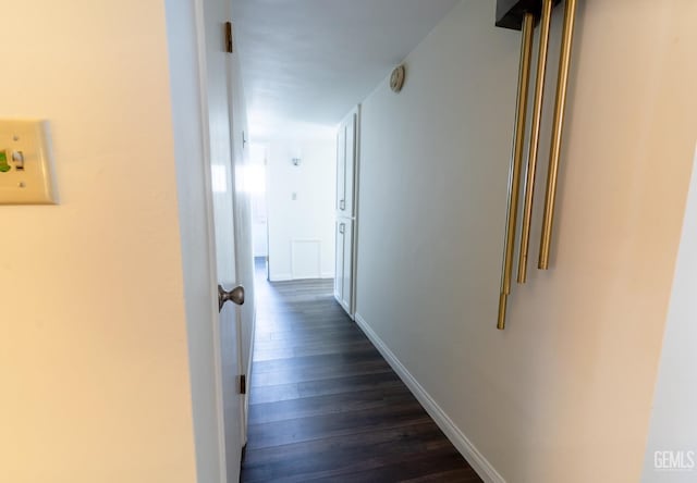 hallway with dark wood-type flooring