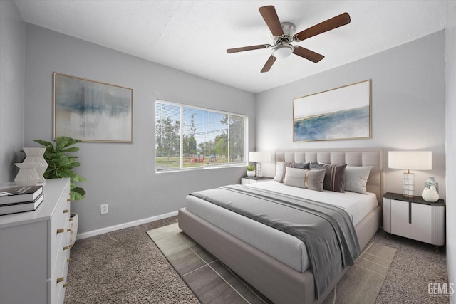 bedroom with carpet, baseboards, and ceiling fan