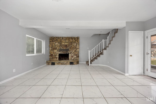 unfurnished living room featuring baseboards, stairs, a stone fireplace, and marble finish floor