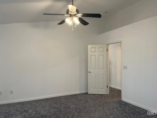 carpeted spare room featuring ceiling fan and high vaulted ceiling