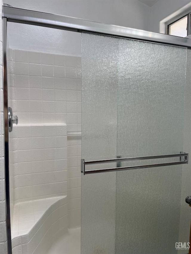 bathroom featuring an enclosed shower