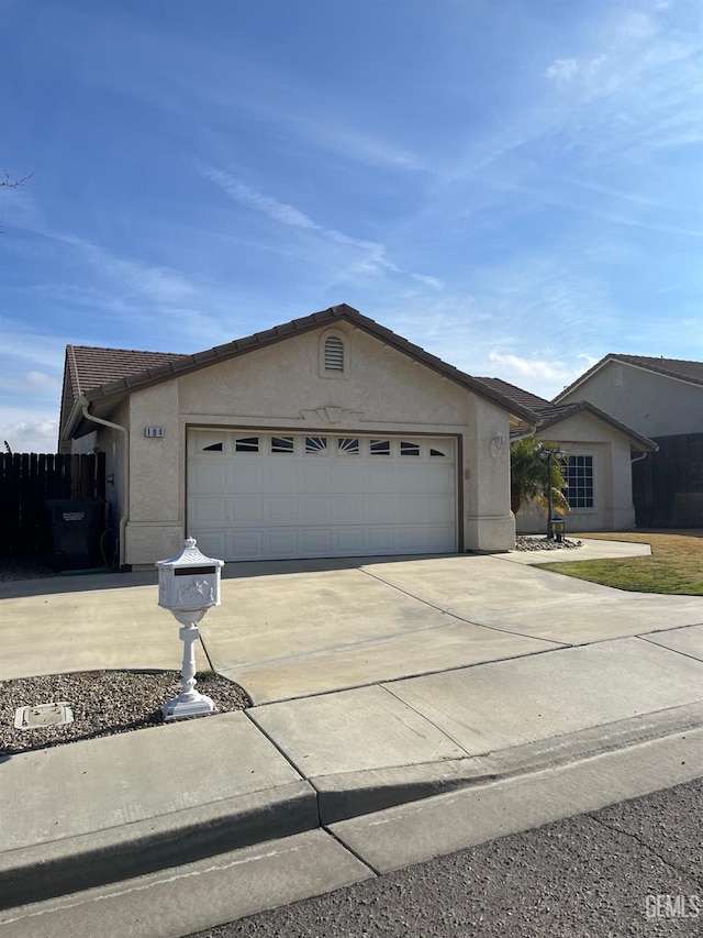 ranch-style house featuring a garage