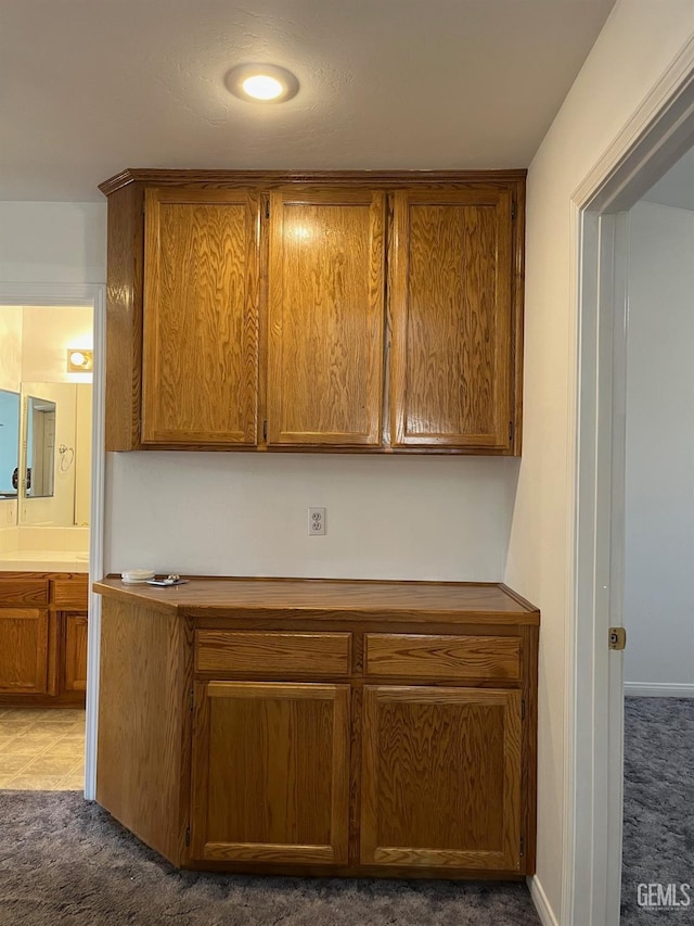 kitchen featuring dark carpet