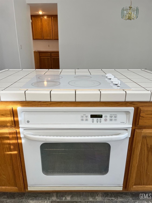 room details with a chandelier and white appliances