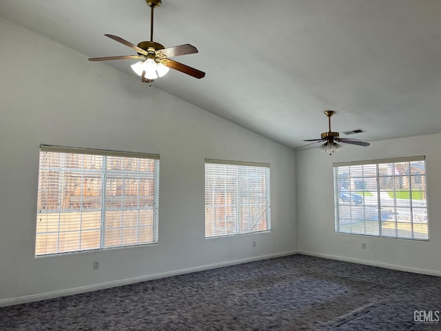 unfurnished room featuring ceiling fan, lofted ceiling, and dark colored carpet