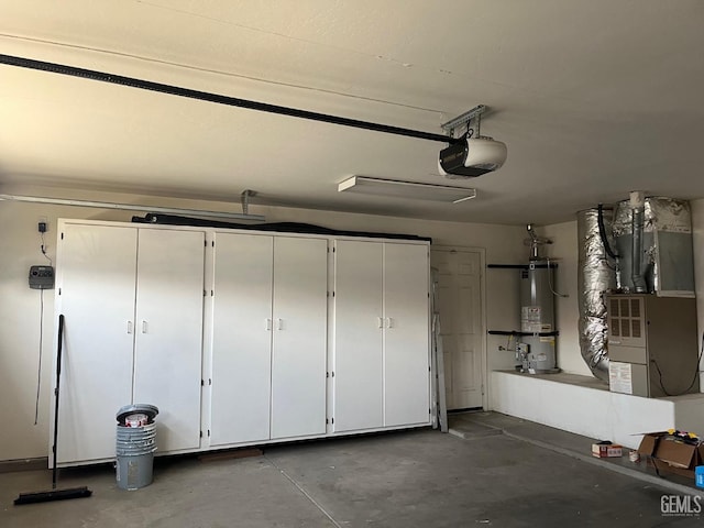 garage with heating unit, water heater, and a garage door opener