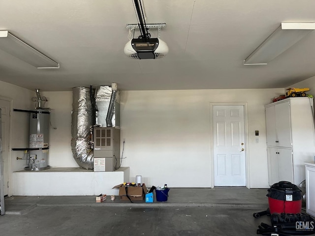 garage with heating unit, a garage door opener, and water heater