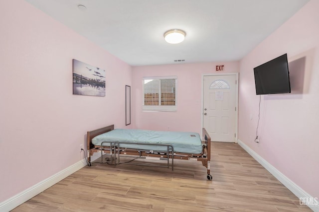 bedroom with light hardwood / wood-style floors