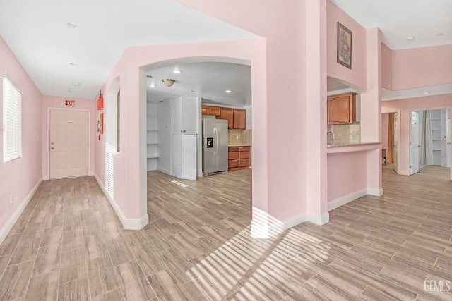 hallway featuring light hardwood / wood-style flooring