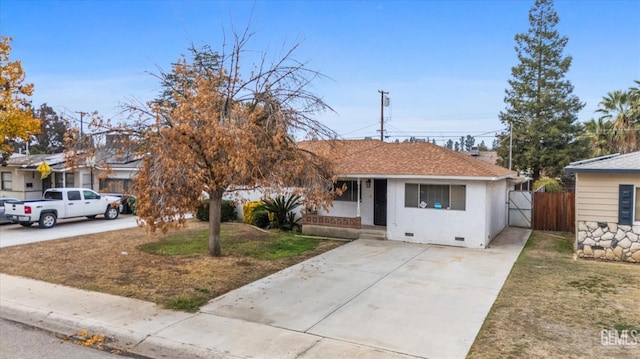 ranch-style house with a front yard