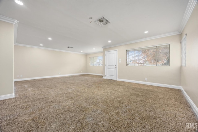 unfurnished room with carpet and crown molding