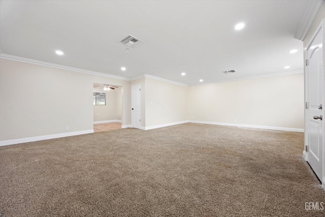 carpeted empty room featuring ceiling fan and crown molding