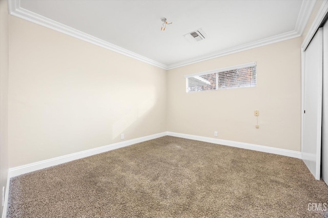 unfurnished bedroom featuring a closet, carpet floors, and ornamental molding