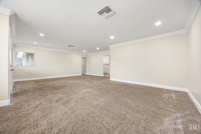 carpeted empty room featuring crown molding