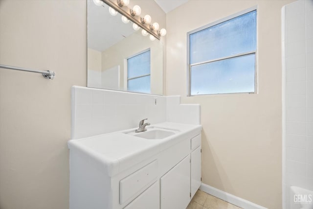 bathroom featuring tile patterned flooring and vanity