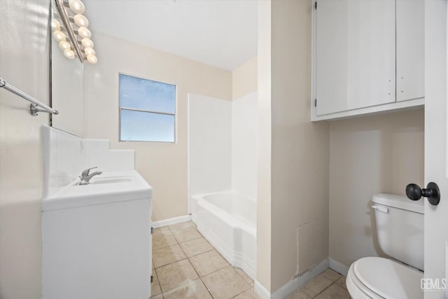 bathroom with tile patterned flooring, sink, toilet, and a bath