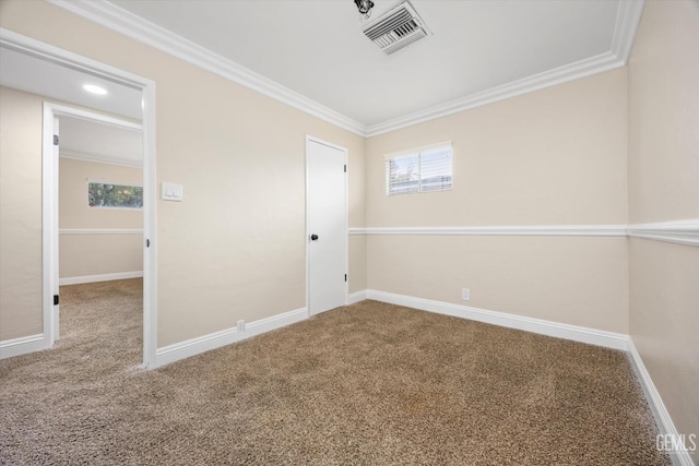 unfurnished room with carpet and crown molding